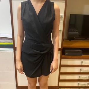 Zara black playsuit with bow details. Size: S